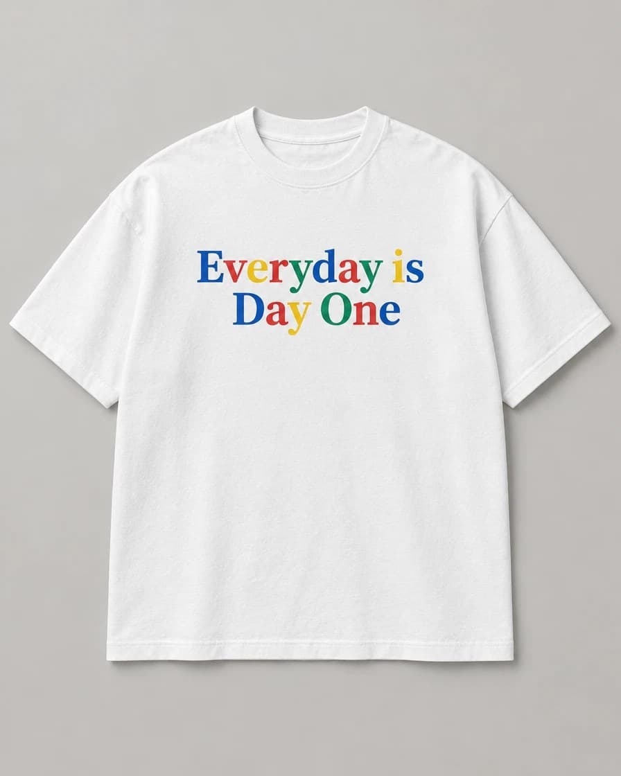 White tee with Everyday is Day One printed in red, blue, yellow and green